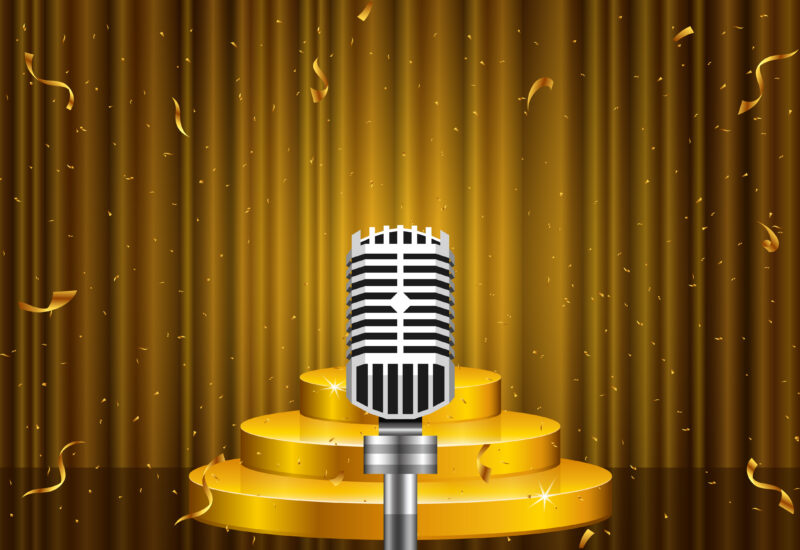 Illustration of a vintage microphone on a gold stage with curtains and confetti.